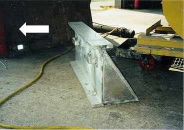 photo shows wide metal alternative after-market body prop laying on floor