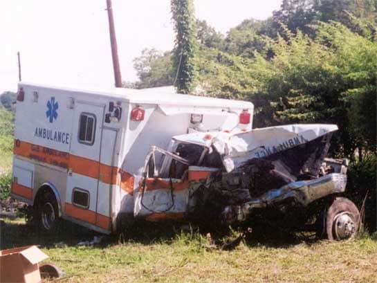 Type I ambulance at employer's vehicle yard after recovery from crash site
