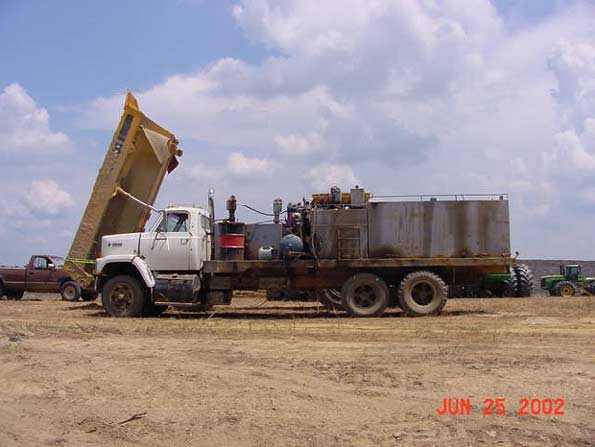 Placement of the service truck and dump truck that the victim was servicing at the time of the incident.