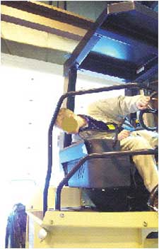 Seat belted operator on a compactor similar to that involved in the incident.