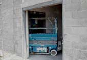 Scissor lift entering classroom doorway