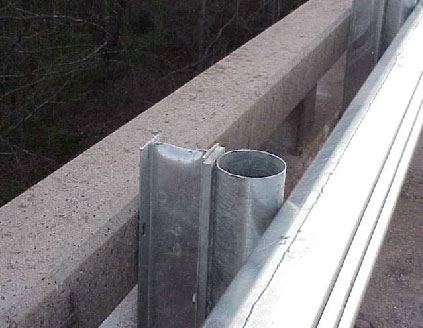 Damaged post located 17 feet east of victims.