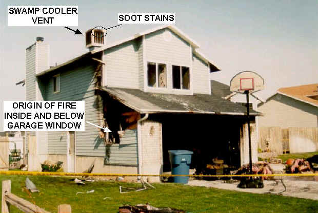 Photo 2: Photo showing the front and south end of the house taken from the street.