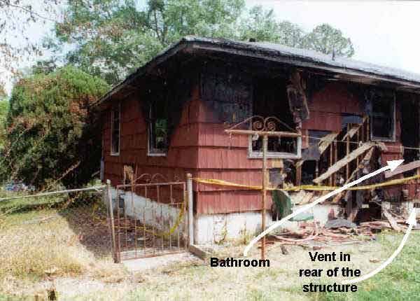 Photograph of the rear of the structure, depicting the location of the bathroom and the rear vent.