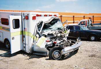 Photo 3. Front cab of ambulance after collision