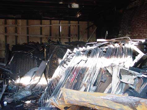 Photo 1. Interior of structure showing contents after fire suppression