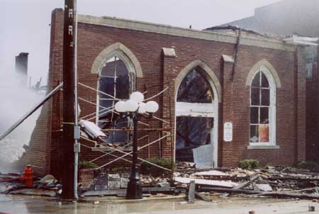 Photo showing front view of burned church.