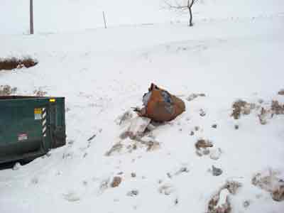 barrel blown from dumpster