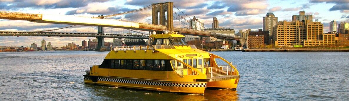 Water taxi and Brooklyn bridge, seen from Pier 17, at Lower Manhattan in New York. Image by icon72, iStock/Getty Images Plus.