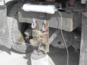 HASARD pipe antenna, laser level device, and protractor template installed on rear of 10-ton haul truck
