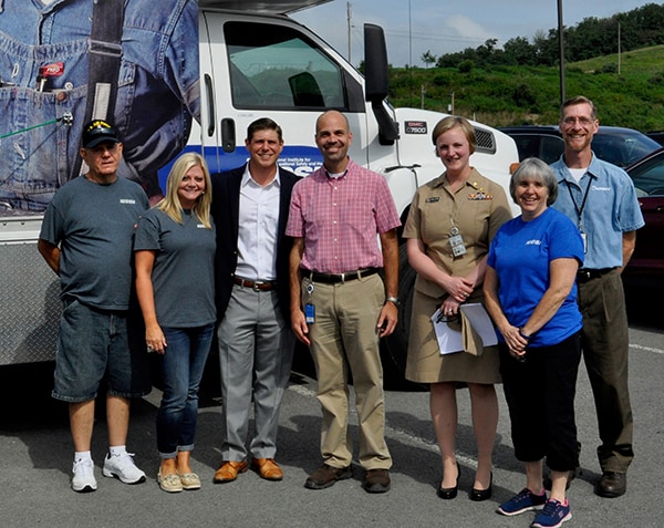 Dr. Johns poses with group at a stop of NIOSH's Coal Worker Health Surveillance Program black lung screening mobile unit.