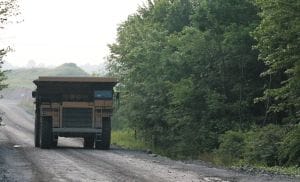 Photo of haul truck travelling on road.