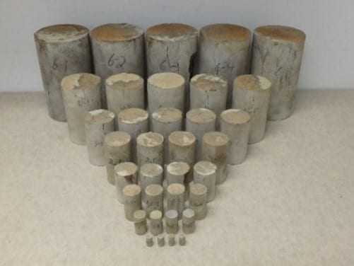 Photo of different cylinders of backfill sizes representing how size effect studies are being conducted on various backfill materials using conventional and novel preparation methods in order to determine the influence of sample size on measured unconfined compressive strength, and to develop new or improved quality assurance/quality control methods for operators.