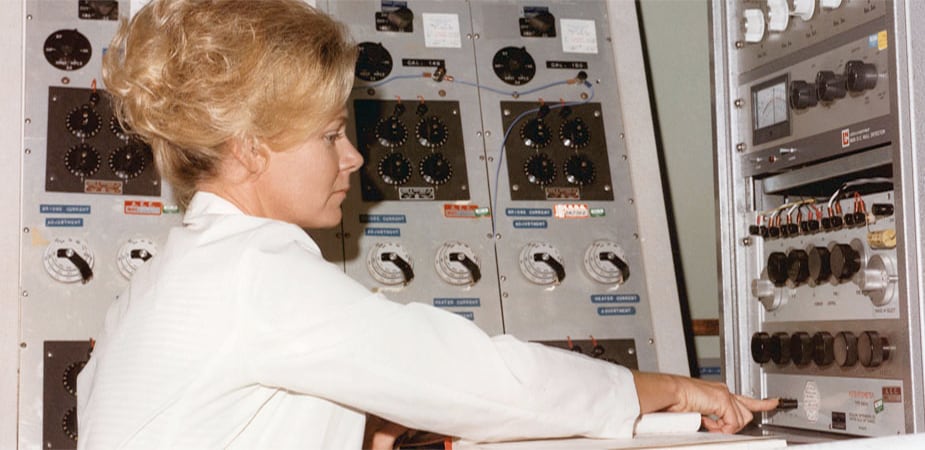 Technician monitors assay of nuclear material (DOE Image Archive)