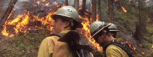 Members of the Wyoming Wildland Firefighter Hotshot Crew monitor burn as it makes its way down a hillside. Image is courtesy of the US Forest Service Technology and Development Program.