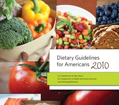 collage of broccoli, blueberries, beans, tomatoes and whole grain bread on the front cover of the 2010 USDA Dietary Guidelines for Americans