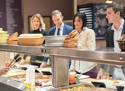 People being served at a buffet