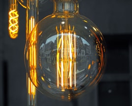 Photo shows lightbulb innovations (a large globe and elongated versions). Free photo.