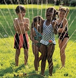 Kids playing in a sprinkler