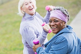 Two senior women exercising