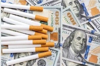 Image of cigarettes and money