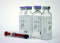 medication vials and syringe