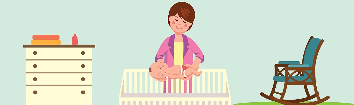 mother putting sleeping baby in crib