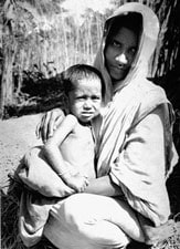 Three-year-old Rahima Banu with her mother in Bangladesh. Rahima was the last known person to have had naturally acquired smallpox in the world. An 8-year-old girl named Bilkisunnessa reported the case to the local Smallpox Eradication Program team and received a 250 Taka reward. Source: CDC/World Health Organization; Stanley O. Foster M.D., M.P.H.