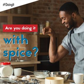 Image displays a man applying a pinch of salt to the ingredients of the meal he is preparing, along with the following text: Are you doing it with spice?