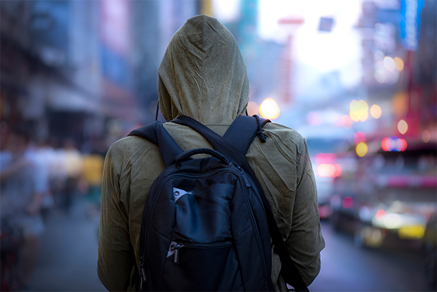 person wearing hoodie and backpack