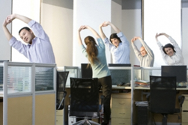 Employees exercising in an office setting