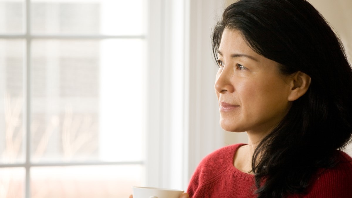 Photo of a woman drinking coffee