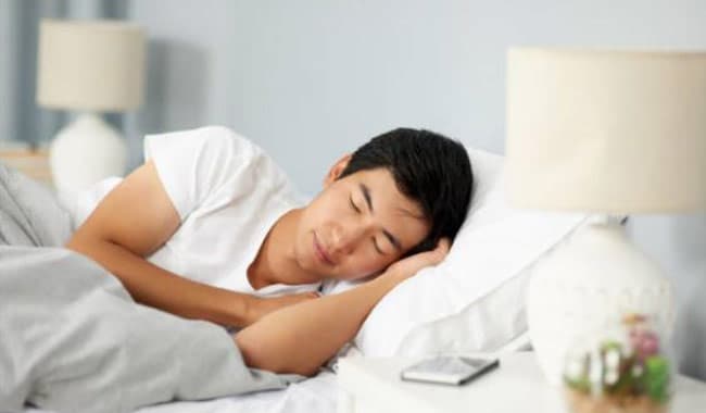 man sleeping on pillow