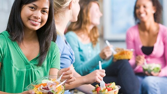 Young women eating healthy meals.