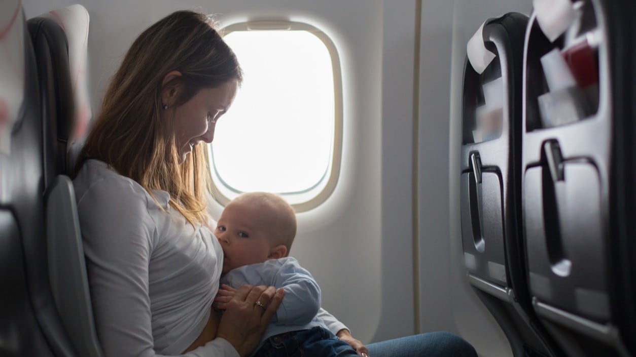 Breastfeeding mother on an airplane.