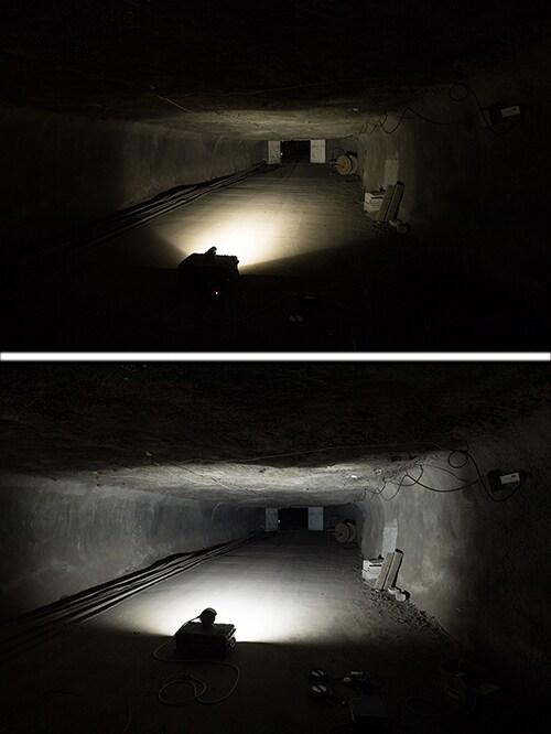 Photograph showing (top)MSHA-approved LED headlight illuminating a mine entry and (bottom)the same mine entry illuminated by the Jupiter 2 light. There is a wider pattern of light shown in the Jupiter 2 image.