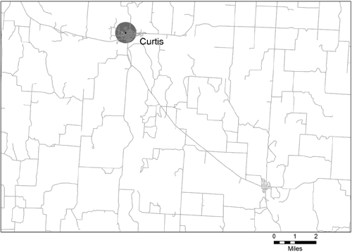 This figure is a map of a portion of Frontier County, Nebraska, and the city of Curtis; the map shows the location of the only school within the approximately 160-square-mile area illustrated. Around the school location is a circle with a one-half mile radius.
