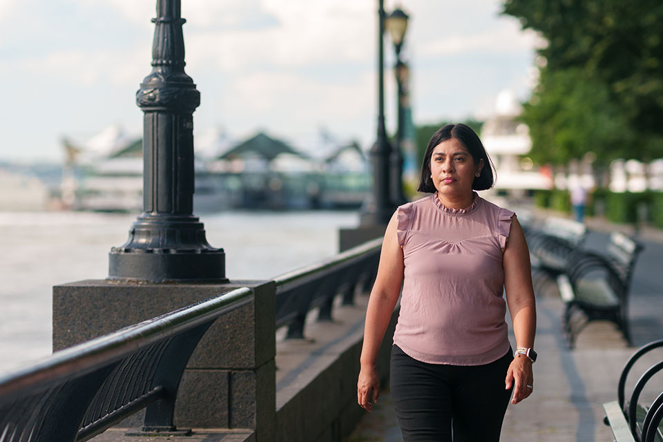 Nadia, a member who enrolled through young adult outreach,
walking by the river in NY.