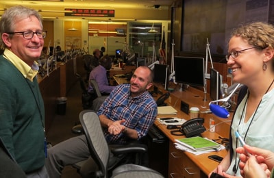 Morgan Hennessey (pictured center) works with a team of epidemiologists in the Emergency Operations Center at CDC’s Atlanta headquarters