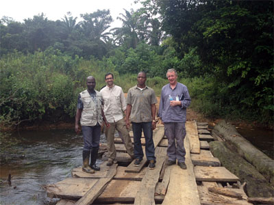 jose2-400px.jpg Jose and his WHO and County Health Department colleagues standing on a bridge they had to reconstruct in order to communicate with nearby villages. (Left to right: Augustine Newray (Liberian Ministry of Health and Social Welfare), Jose (CDC EISO), Wilmot Smith (Rivercess County Health Team), and Jarlath Tunney (WHO).)