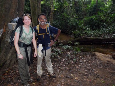 Satish and his colleague Laura hiking in the Liberian jungle on the way to a remote community with suspected Ebola cases. 