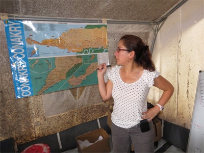 Fatima during her deployment in Guinea, discussing strategies for high risk areas in Conakry, the capital city. 