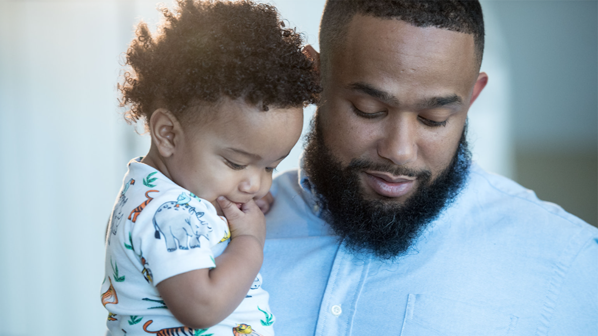Father holding his baby.