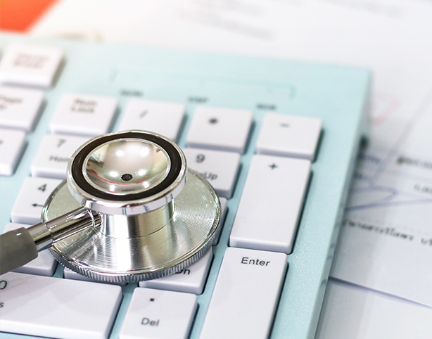 close up of a stethoscope on a laptop keyboard