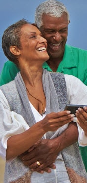 Elderly couple looking at a smart phone