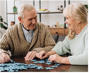Elderly Couple doing a puzzle