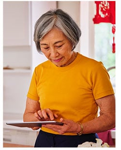 Older Woman on tablet 