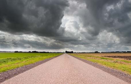 Straight Road under Brooding Sky
