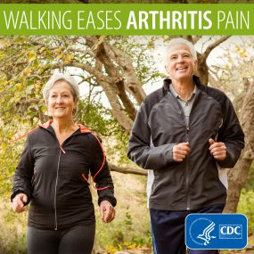 Older couple walking in the park. Text says Walking eases arthritis pain.