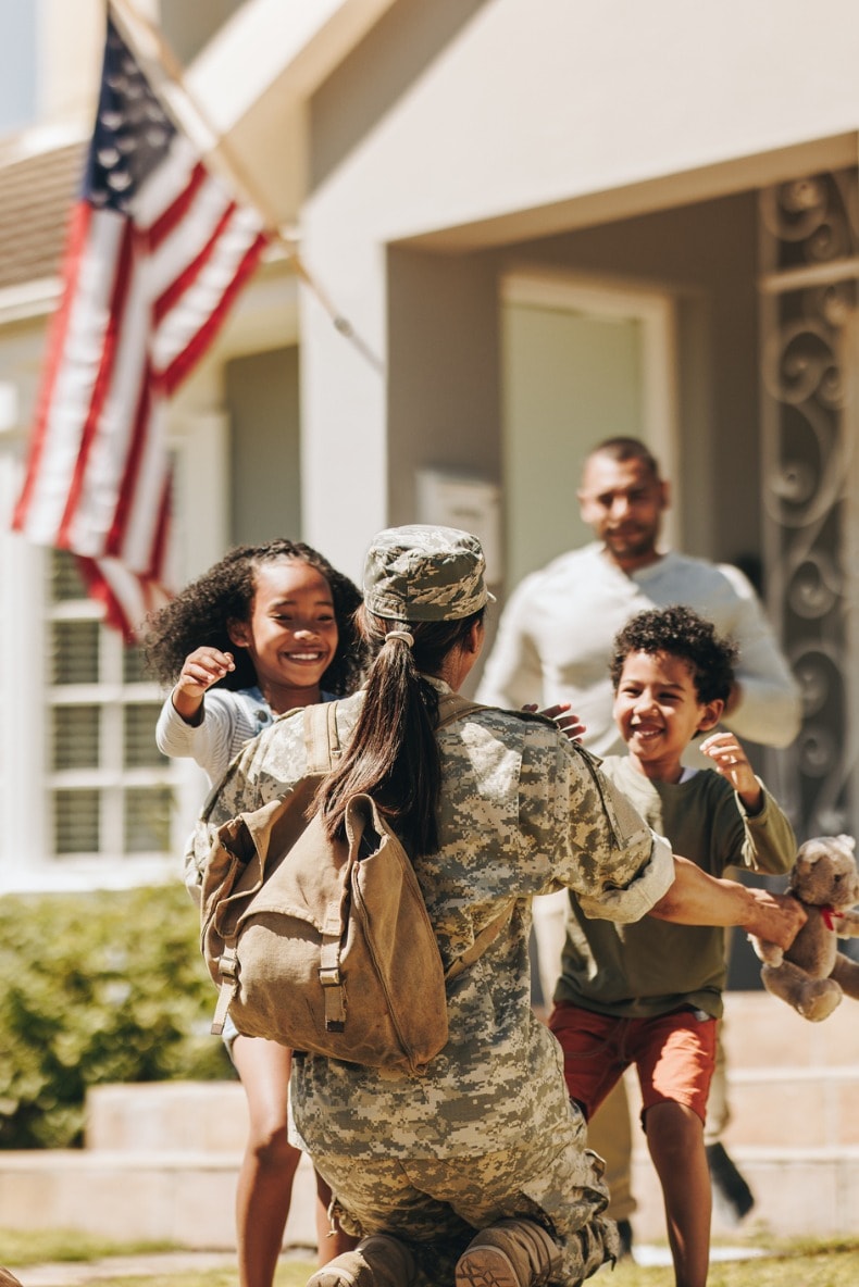 Military mom greeting her family.